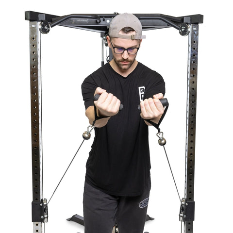 Bells of steel all in one trainer functional trainer view with man doing cable flies
