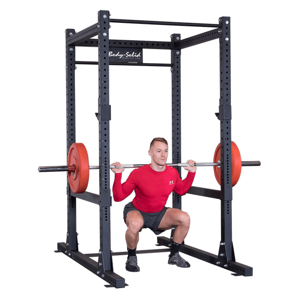 Body Solid SPR1000 Power Squat Rack with Man Inside Squating