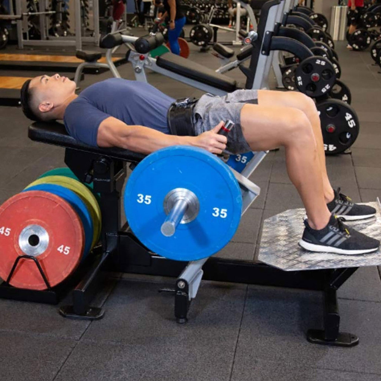 Real life view of a hip thrust machine with a male user