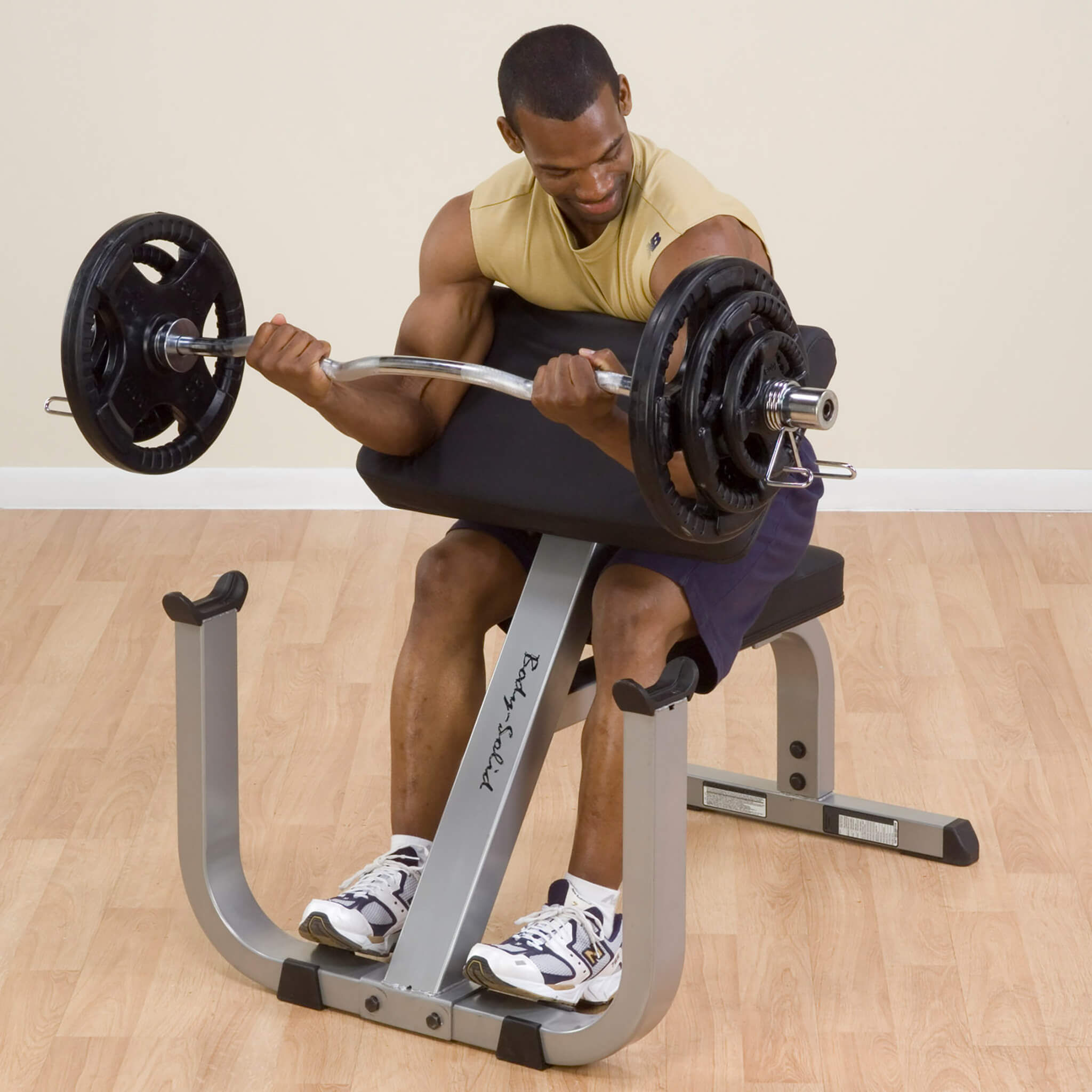 preacher curl bench gpcb329 man doing biceps curl