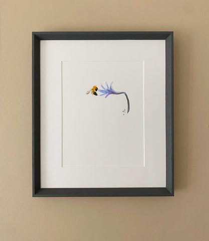 Framed painting of bee hovering alongside agapanthus flower