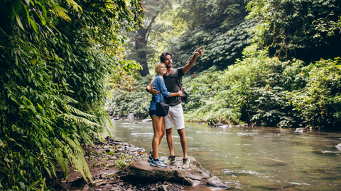 Man and woman looking at forest