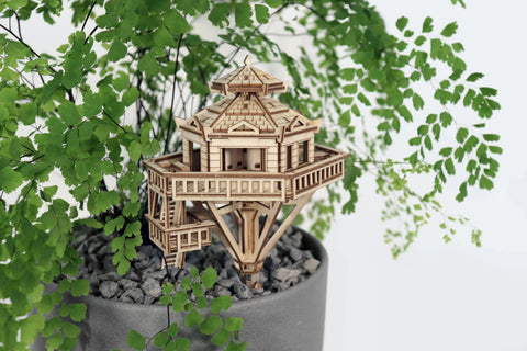 Wooden tree house kit in potted plant
