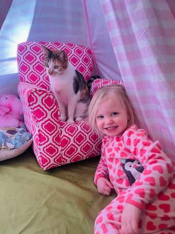 One of Leigh’s kittens, Maeve, and her daughter already know to how lounge in style and color-coordinate.