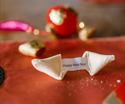 Fortune cookie that says Happy New Year