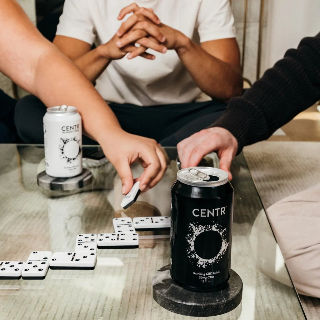 people playing domino while drinking CENTR CBD sparkling water
