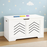 White toy storage box with chevron design on a wall with star and cloud decorations.
