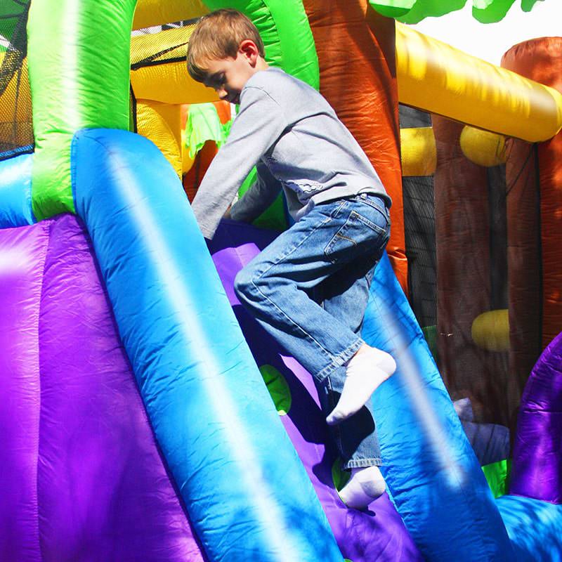 kid-wise-monkey-explorer-jumper-inflatable-bounce-house-kid-climbing-rock-wall-outside