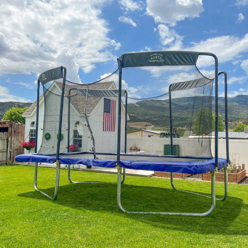 Skywalker Trampolines 17' x 10' Rectangle Olympic-Sized Premium Trampoline with Enclosure - LMG-SPTRC1710 with mountain view