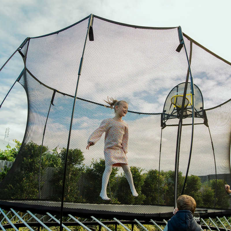 Springfree trampoline with girl jumping