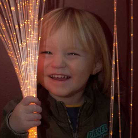 Sensory Light Curtain and Illuminator with boy smiling