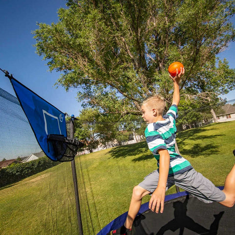 Skywalker Trampoline Basketball Hoop with boy playing