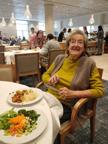 Elderly grandma living in assisted living eating
