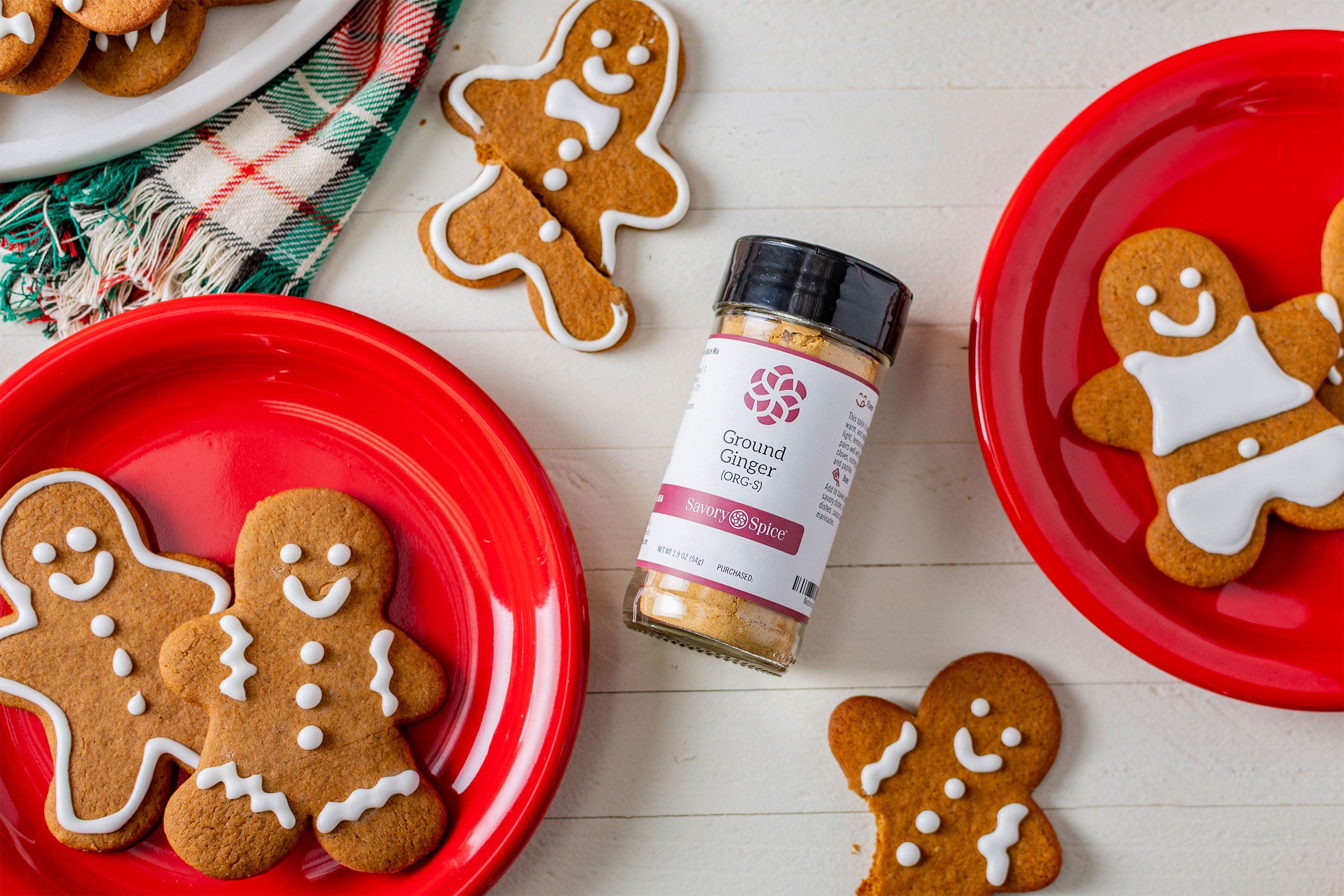 Gingerbread cookies with a jar of ground ginger