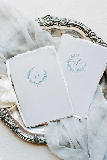 custom paper vow books with monogram crest