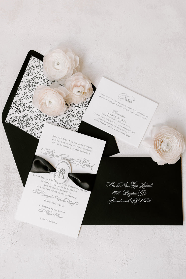 black and white wedding invitation with Elegant Quill monogram