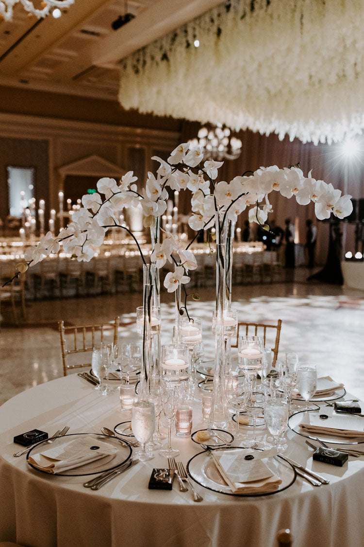 luxe wedding table setting with white orchids
