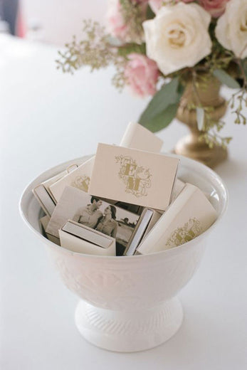 monogrammed wedding matchboxes in white bowl