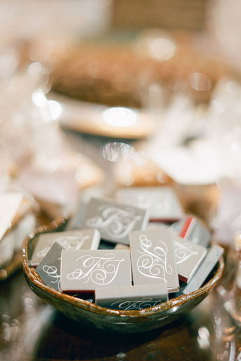 monogrammed gray matchboxes as wedding favors