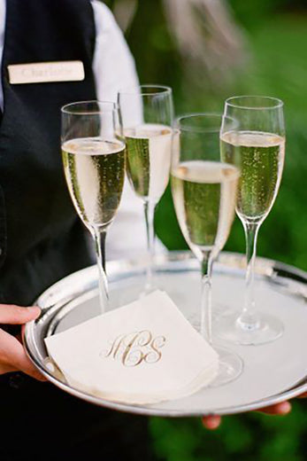 monogrammed paper napkins passed out with champagne