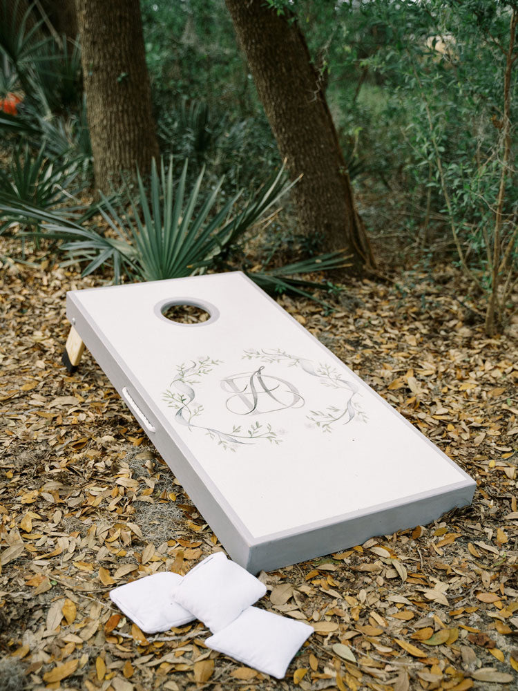 personalized cornhole board with Elegant Quill wedding monogram