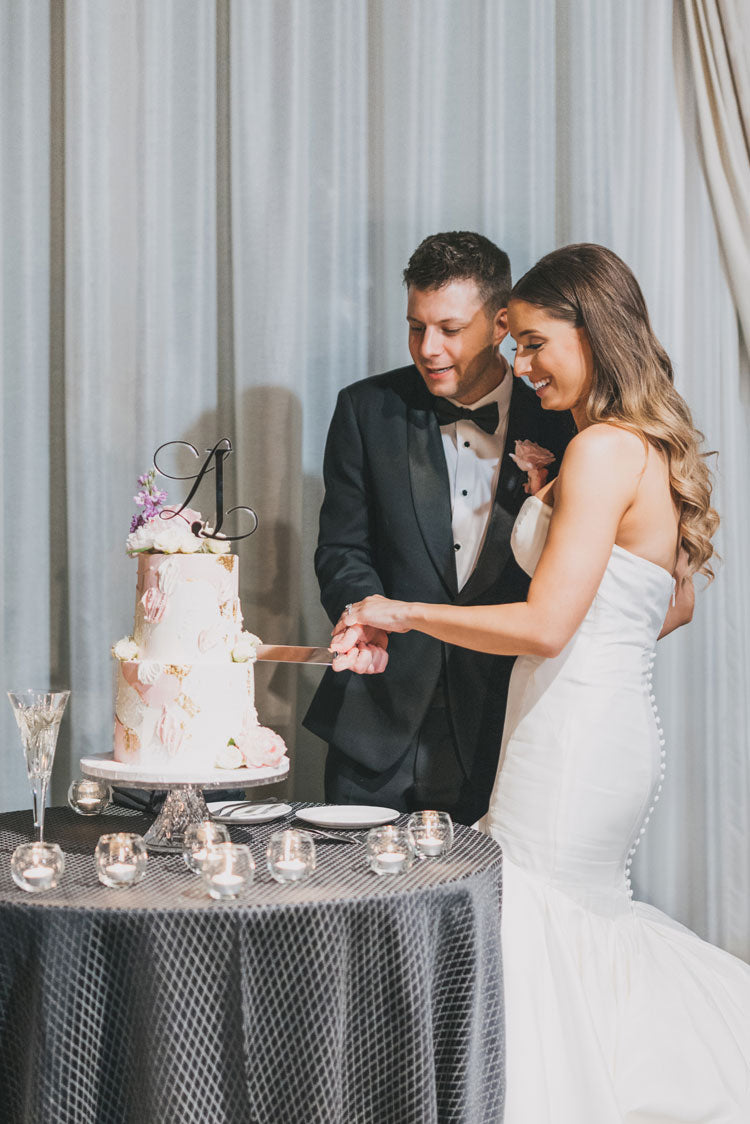 wedding cake cutting with Elegant Quill monogram topper