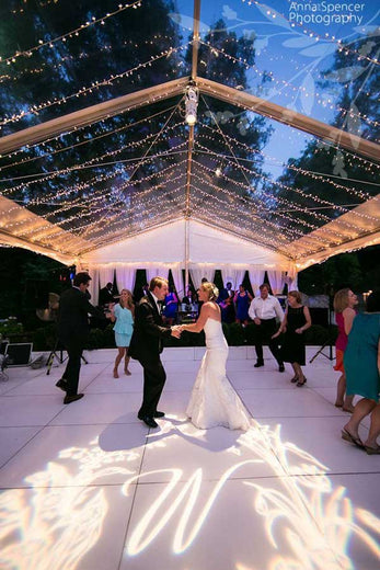 monogram illuminated on wedding dance floor