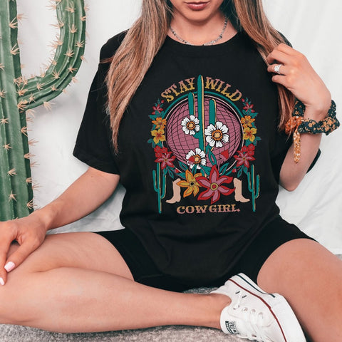 Western graphic t- shirt with stay wild cowgirl print a cactus and boots