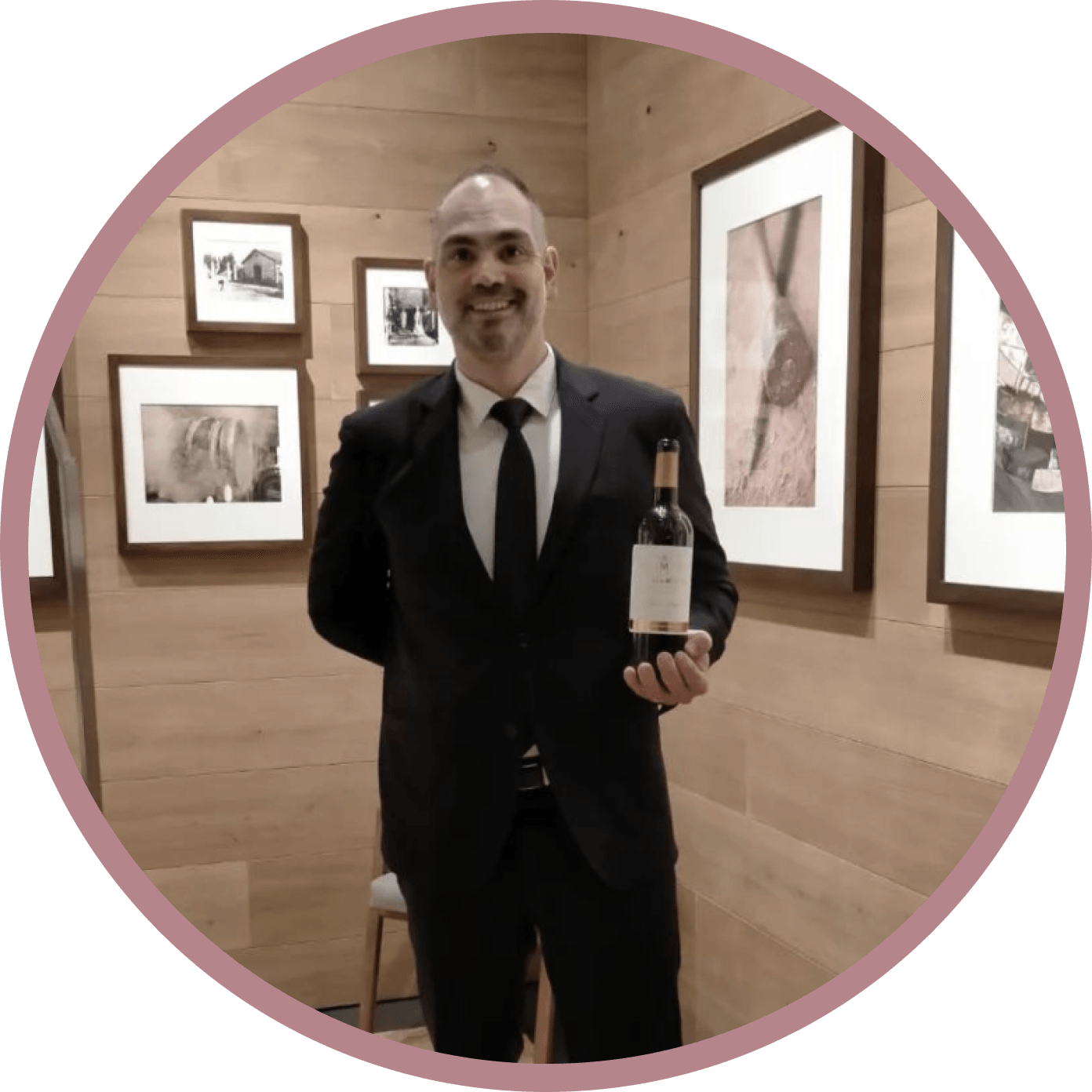 Uruguayan sommelier Frederico Moura smiling while holding a glass of wine.