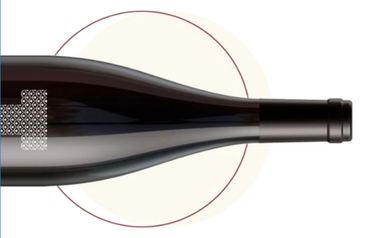  A black bottle of premium wine laid horizontally on a white background