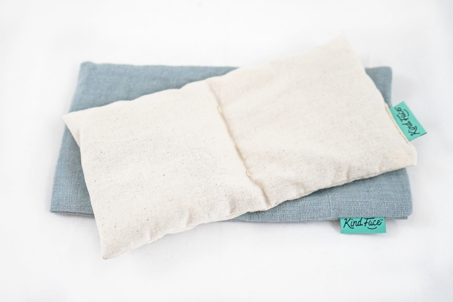 Kind Face_Weighted Eye Pillow_Calico inner resting on cover-COPENHAGEN linen.jpg__PID:ab1d038b-c1a2-4f88-a34a-bd59379f05ce