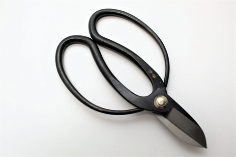 Garden scissors are small, handheld cutting tools designed for pruning herbs, flowers, and small shrubs