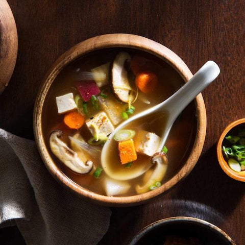 A delicious bowl of miso soup with tofu and other vegetables