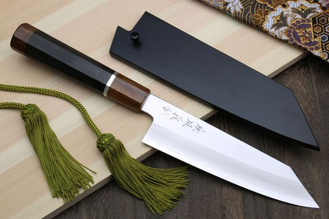 The Kiritsuke is a versatile blade, combining slicing and chopping capabilities, often a symbol of culinary mastery