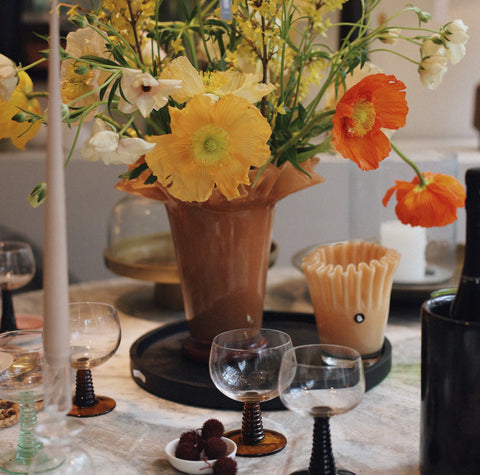 table setting with fresh flowers from garden in a wavey vase