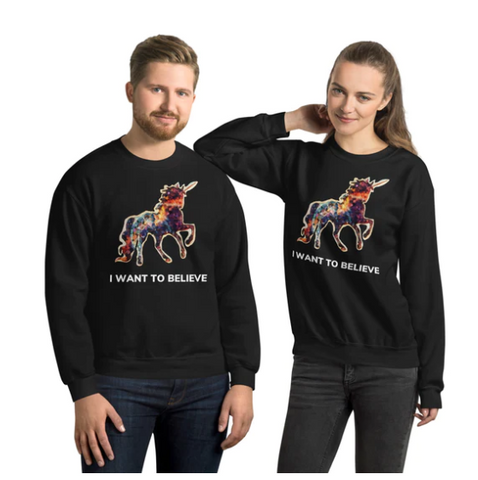 A man and woman wearing matching Real Unicorn Apparel "I Want To Believe In Unicorns" sweatshirts.