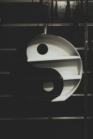 A yin and yang on a wall, photographed by ALTEREDSNAPS