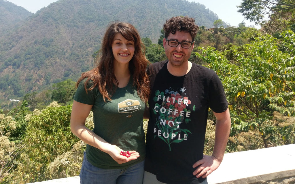 Water Street Coffee crew holding coffee cherries