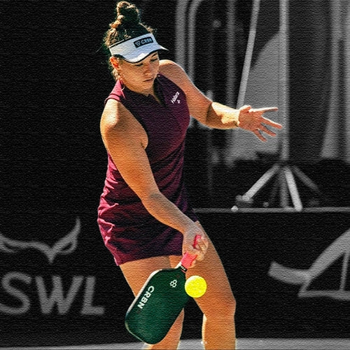 Athlete using GripX Technology spray on pickleball paddle