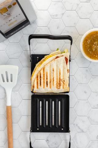 toasted quesadilla sitting in an open toastie press