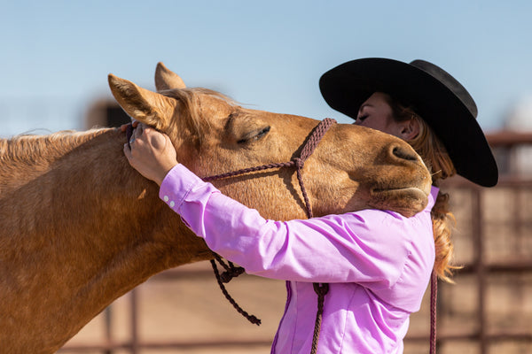 : Cortner incorporates deep muscle work and stretching into her regimen to help alleviate tension throughout the whole equine body. Photo by Kristen Schurr. Fortitude Equine