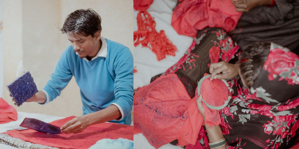 Indian artisan doing block printing and embroidered on a red cotton fabric