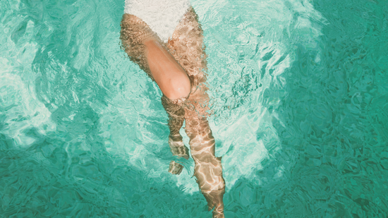 woman swimming in sea on her period