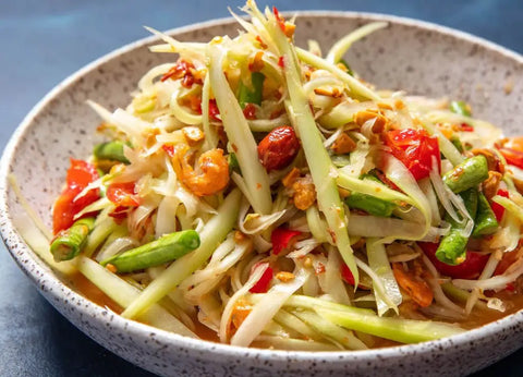 Some include vegetables like cabbage, carrots, and cucumber, while others use only green papaya salad.