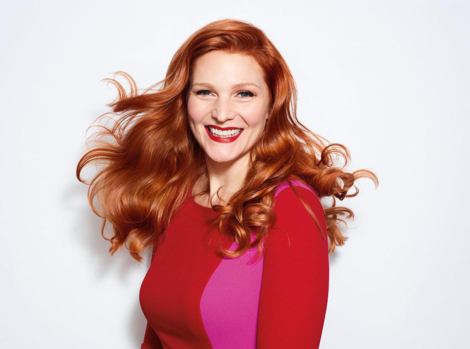 smiling woman with red hair