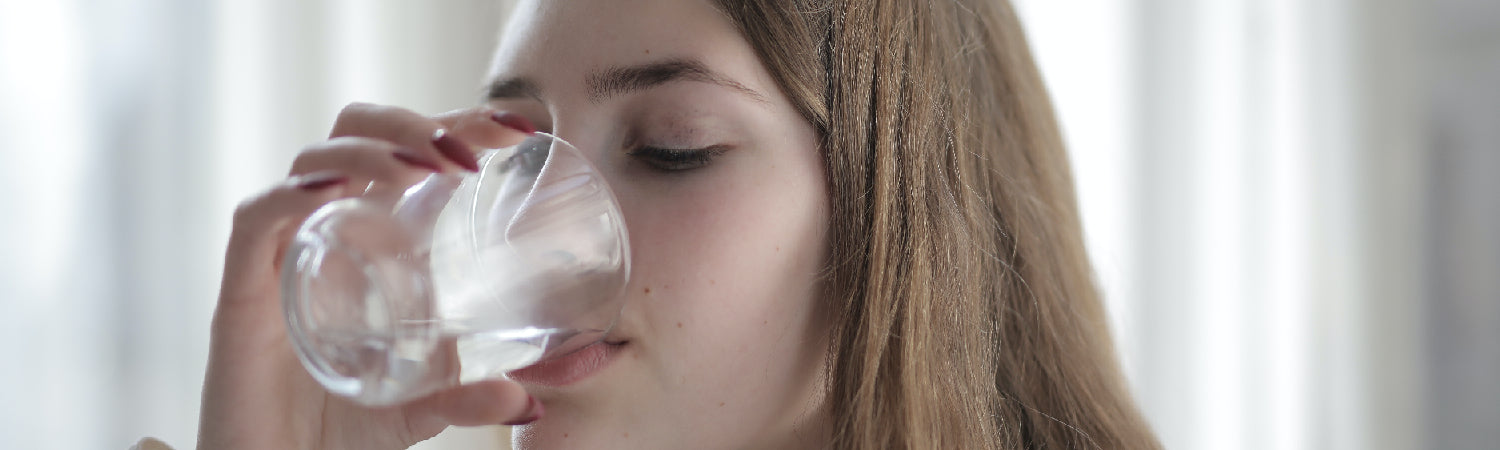 the girl is drinking water