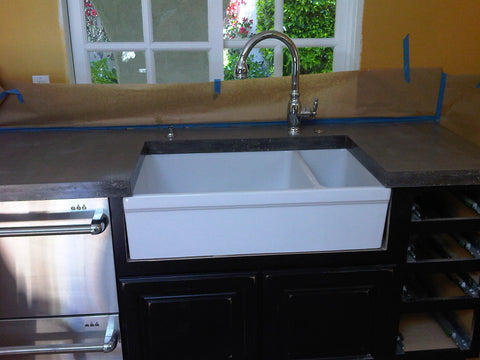 Concrete countertop with apron front sink. 