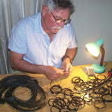 Francis Cary-Smith (AKA Neale) hard at work weaving his craft making elephant hair bracelets.