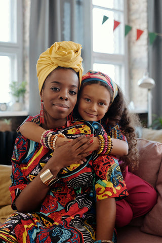 Mother and daughter spotting afrocentric clothing & accessories
