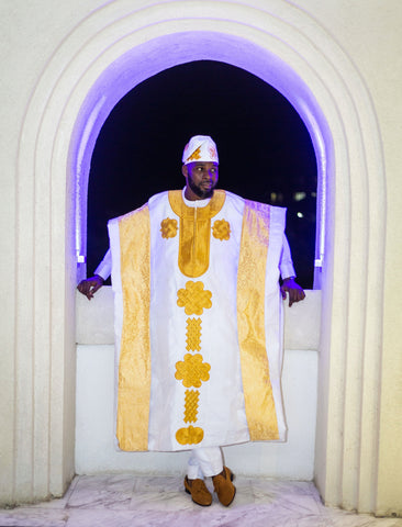 Man in white and gold agbada